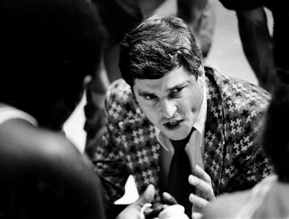 Indiana coach Bobby Knight talks with his team during a timeout in their championship game against Kentucky. The Hoosiers defeated the Kentucky Wildcats 72-65 to win the Mideast Regional championship before 16,000 at Memorial Gym March on 17, 1973.