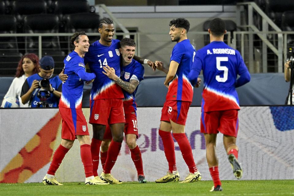 Mar 21, 2024; Arlington, Texas, USA; United States forward Brenden Aaronson (11) and midfielder Haji Wright (14) and forward Christian Pulisic (10) and forward Ricardo Pepi (9) and defender Antonee Robinson (5) celebrates a goal scored by Wright against Jamaica during the game between the United States and Jamaica at AT&T Stadium. Mandatory Credit: Jerome Miron-USA TODAY Sports