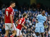 Manchester City's Dedryck Boyata (R) reacts after missing a chance to score against Middlesbrough during their English FA Cup 4th round soccer match at the Etihad Stadium in Manchester, northern England, January 24, 2015. REUTERS/Darren Staples (BRITAIN - Tags: SPORT SOCCER)