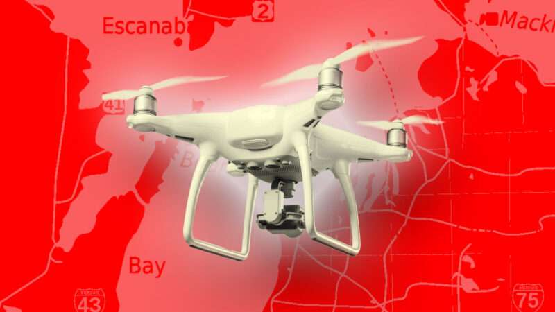 A consumer drone against the backdrop of a map of Michigan.