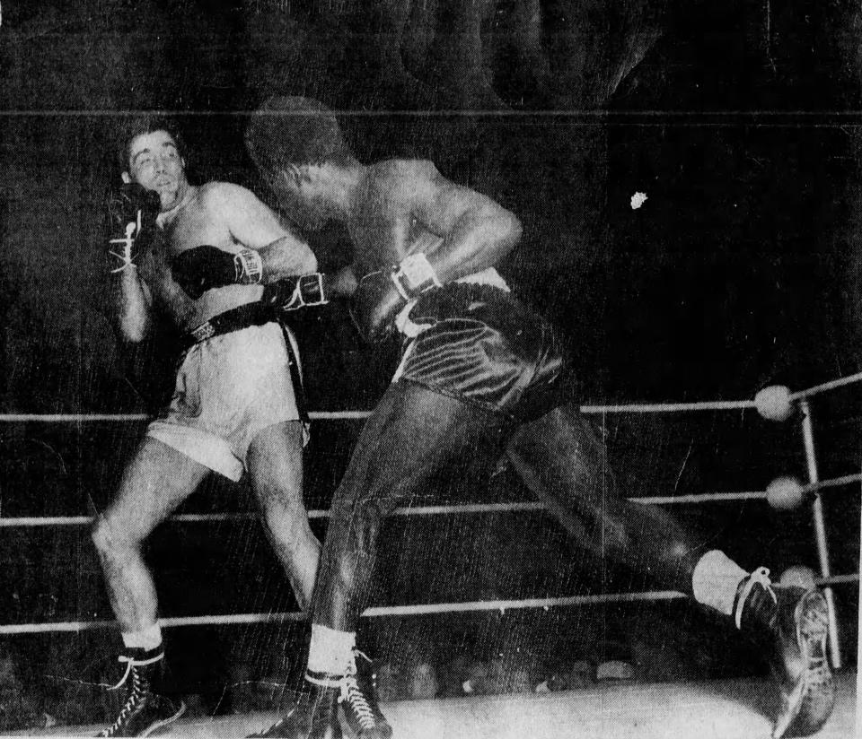 Ezzard Charles, right, won a split decision over Joey Maxim on Feb. 28, 1949, in the first week Cincinnati Gardens was open.
