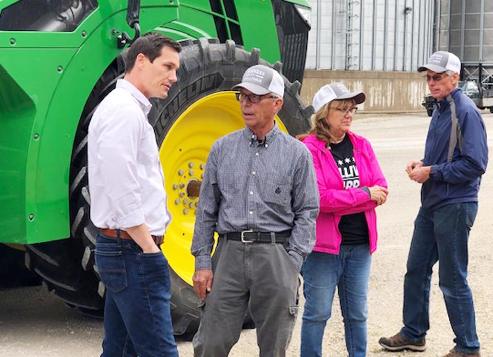 Republican gubernatorial candidate Jesse Sullivan speaks with farmers during a visit to the Prairie Central Cooperative grain elevator near Chenoa Wednesday.