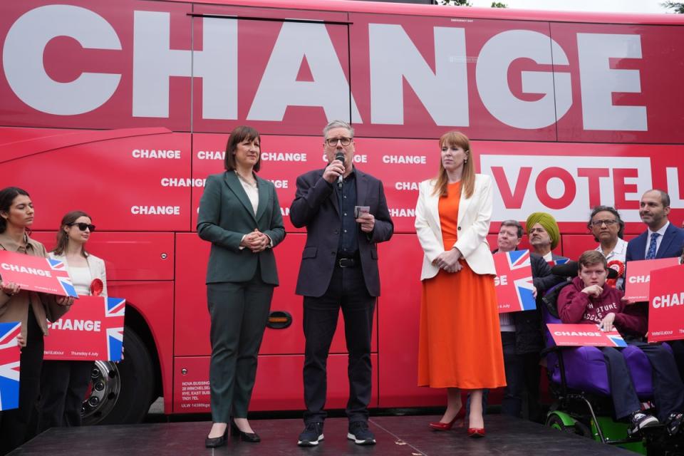 (From left to right) Shadow chancellor Rachel Reeves, Labour Party leader Sir Keir Starmer and deputy Labour leader Angela Rayner, at the launch event for Labour’s campaign bus at Uxbridge College, London (PA)