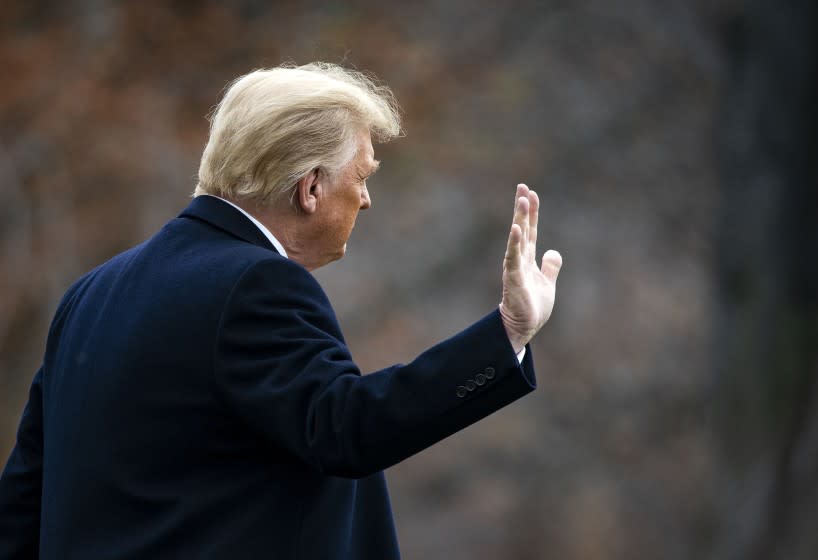 President Donald Trump waves as he departs on the South Lawn of the White House, on December 12, 2020