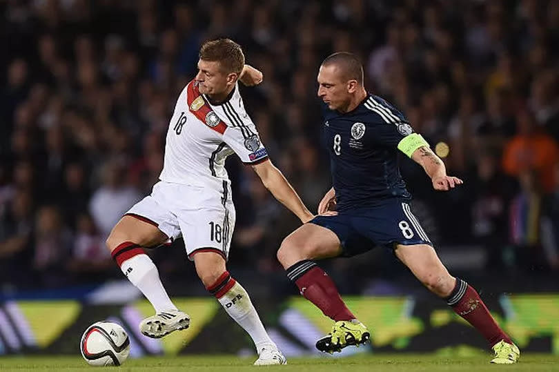 Scott Brown and Toni Kroos battle for the ball at Hampden Park in 2015