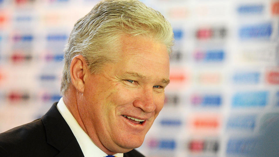 Pictured here, Dean Jones cracks a big smile during a press conference.