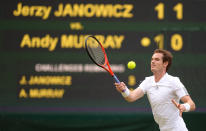 Great Britain's Andy Murray in action against Poland's Jerzy Janowicz during day eleven of the Wimbledon Championships at The All England Lawn Tennis and Croquet Club, Wimbledon.