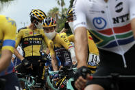 Slovenia's Primoz Roglic, center left, wears a face mask prior to the start of the first stage of the Tour de France cycling race over 156 kilometers (97 miles) with start and finish in Nice, southern France, Saturday, Aug. 29, 2020. (AP Photo/Christophe Ena)