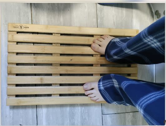 But if you don't like the idea of fabric bath mats at all, this bamboo option has got your back.