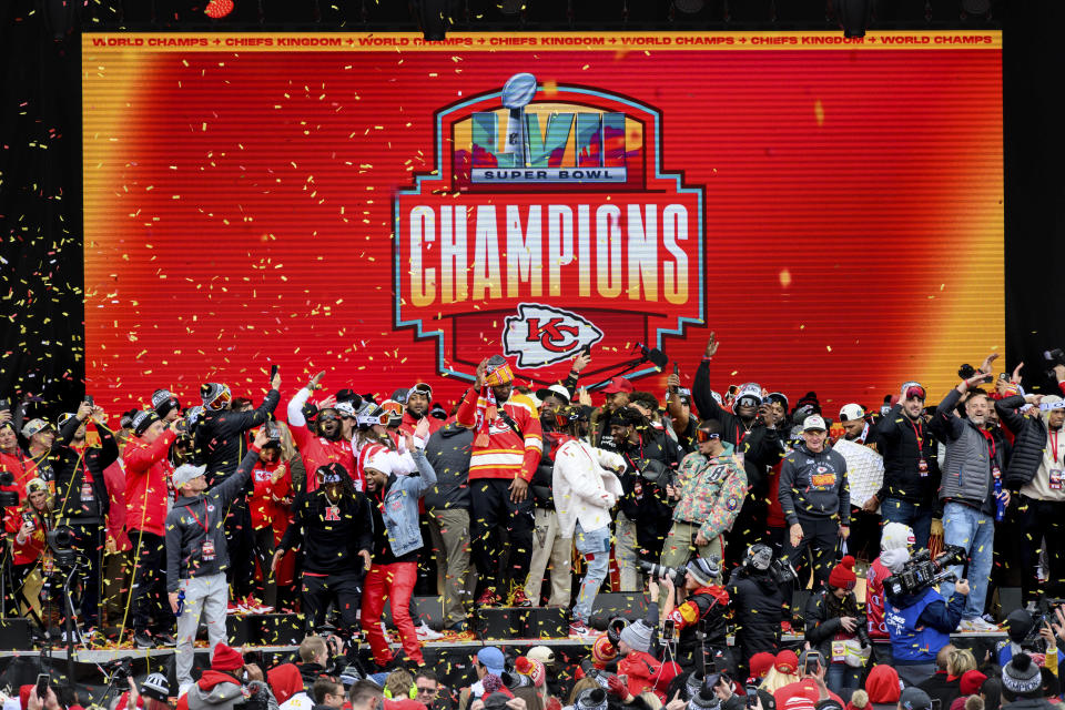 Kansas City Chiefs players celebrate during the Chiefs' victory celebration and parade in Kansas City, Mo., Wednesday, Feb. 15, 2023. The Chiefs defeated the Philadelphia Eagles Sunday in the NFL Super Bowl 57 football game. (AP Photo/Reed Hoffmann)