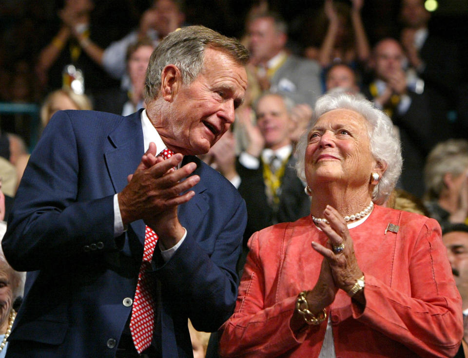 George and Barbara Bush applaud during the evening session of day one of the Republican National Convention on Aug. 30, 2004, at Madison Square Garden in New York.