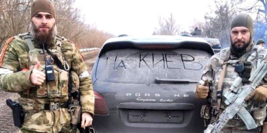 Kadyrov's soldiers posing with a stolen car in Kyiv Oblast