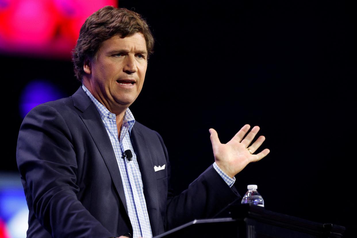 Tucker Carlson addresses the Turning Point Action Conference in Florida on 15 July. (REUTERS)