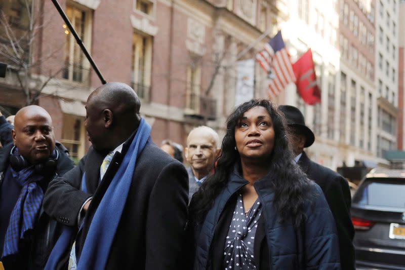 FILE PHOTO: Tamara Lanier looks up as she walks with attorney Ben Crump after speaking to the media, outside of the Harvard Club in New York