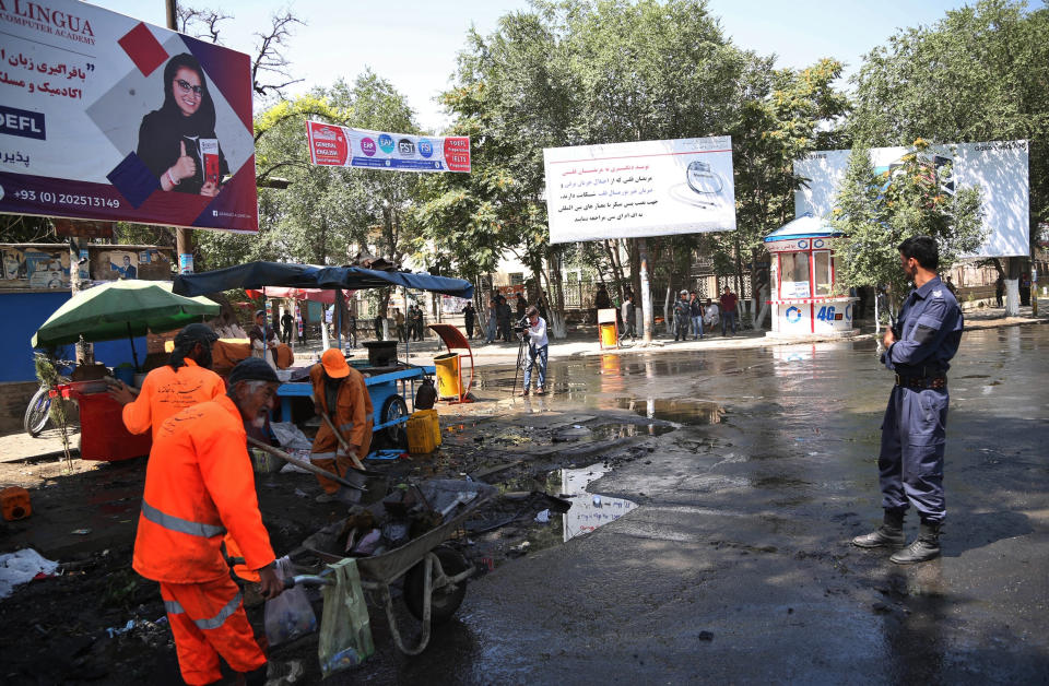 Afghan security forces stand guard near the site of an explosion in Kabul, Afghanistan, Friday, July 19, 2019. A powerful bomb exploded outside the gates of Kabul University in the Afghan capital on Friday, according to police and health officials. (AP Photo)