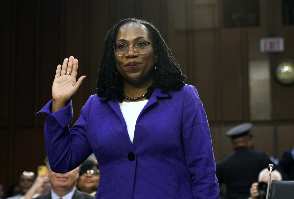 Ketanji Brown Jackson raises her right hand as she is sworn in during her confirmation hearing before the Senate Judiciary Committee. 
