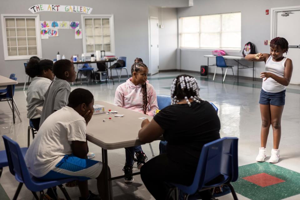 Jariya Silket Petty, 9, right, acts out feeding a dog during a game of charades at the Rocksprings Community Center during the opening week of the Boys & Girls Club’s satellite campus on Thursday, June 30, 2022 in Athens. The Rocksprings site, the club serves approximately eighteen children and provides meals, academic assistance and various games and activities.