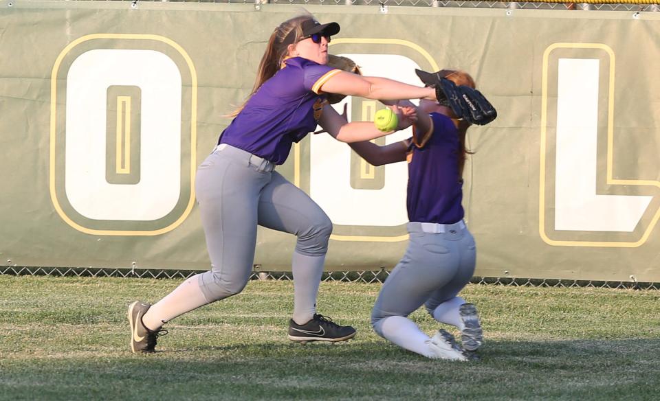 Nevada left fielder Joslynn Farmer (9) and center fielder Kylie Taylor (2) attempt to catch a fly ball during the fourth inning of the Cubs' 12-0 loss to Class 3A No. 7 Saydel at Saydel High School's softball field Wednesday, June 21, 2023, in Des Moines, Iowa.