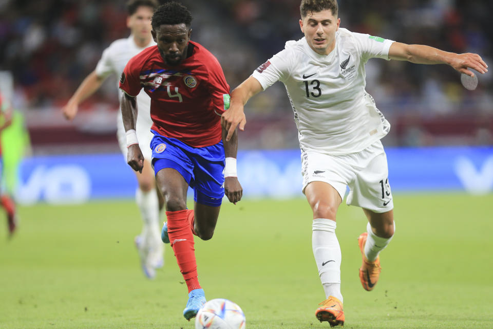 /c4/, left, and /n13/ fight for the ball during the World Cup 2022 qualifying play-off soccer match between New Zealand and Costa Rica in Al Rayyan, Qatar, Tuesday, June 14, 2022. (AP Photo/Hussein Sayed)