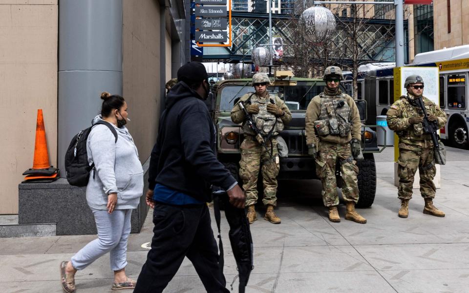 People arrive for the verdict in Derek Chauvin's trial over the death of George Floyd outside the Hennepin County Courthouse in Minneapolis, Minnesota - Kerem Yucel / AFP