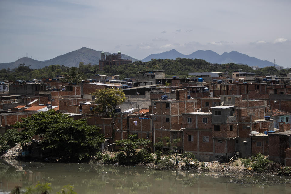 FILE - Homes stand in the Maré favela in Rio de Janeiro, Brazil, Nov. 15, 2021. When Rio state's military police conduct operations and face off with local drug traffickers, class is canceled and kids take shelter at home. (AP Photo/Bruna Prado, File)