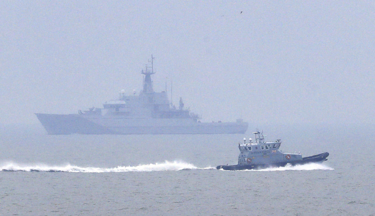 A Border Force patrol vessel, foreground, and the HMS Mersey on patrol in The Channel in Kent, Friday, Jan. 11, 2019. (Gareth Fuller/PA via AP)