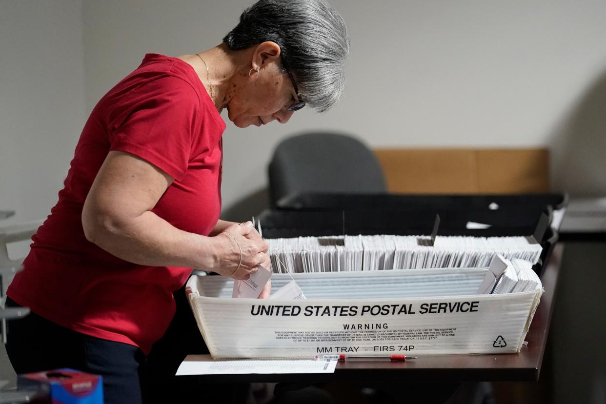 An election worker continues the process in counting ballots for the Pennsylvania primary election, Wednesday, May 18, 2022, at the Mercer County Elections Board in Mercer, Pa.