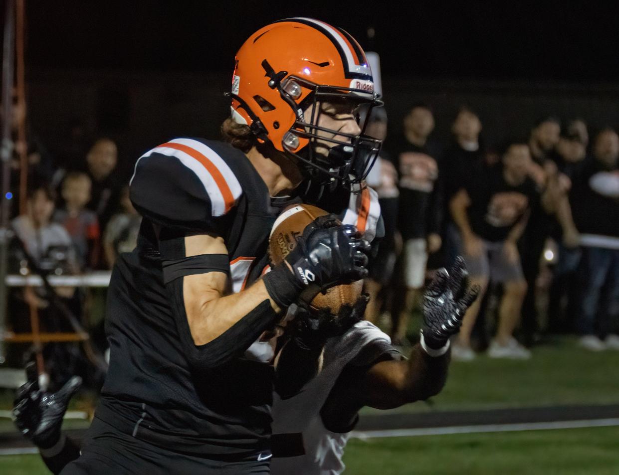 Hoover’s Zach Braucher makes a touchdown reception against McKinley with 15 seconds left in the first half, Friday, Sept. 22, 2023.