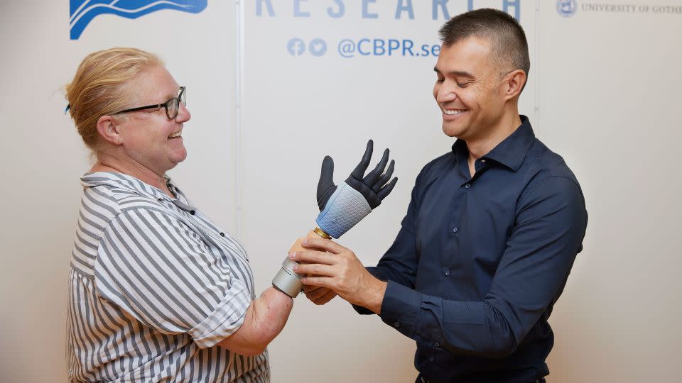 Karin with her integrated bionic hand and Dr. Max Ortiz Catalan. - From Ortiz-Catalan et al., Sci. Rob., 2023.