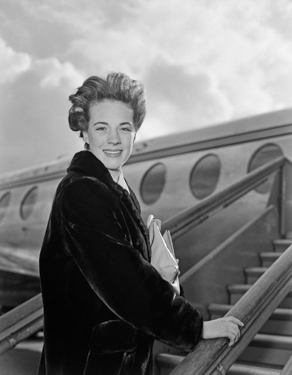 British actress Julie Andrews boarding a flight at London Airport, March 6th 1959.