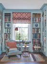 <p> Symmetry in interior design can be used across the home, and if you have an abundance of shelving in a room, whether that be in a study, <a href="https://www.homesandgardens.com/ideas/home-library-ideas" rel="nofollow noopener" target="_blank" data-ylk="slk:home library" class="link ">home library</a> or living room space, styling the shelves symmetrically can create a sense of balance and calm. </p> <p> In this cozy reading the room, the shelves are mainly used for the storage and display of books. However, by keeping two shelves free and styling them with the matching decorative vases, both an element of contrast and a calming focal point is created within the library of books. </p>