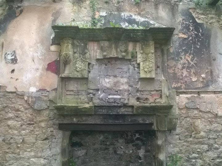 A crumbling mantle over a fireplace in gwyrch castle