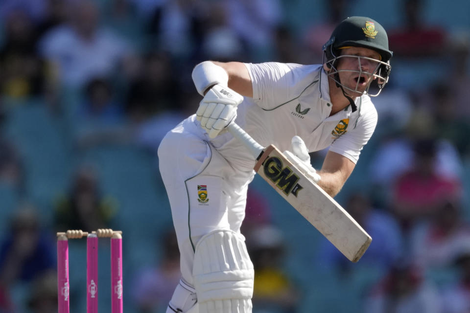 South Africa's Sarel Erwee is struck by delivery from Australia's Pat Cummins during the fifth day of their cricket test match at the Sydney Cricket Ground in Sydney, Sunday, Jan. 8, 2023. (AP Photo/Rick Rycroft)