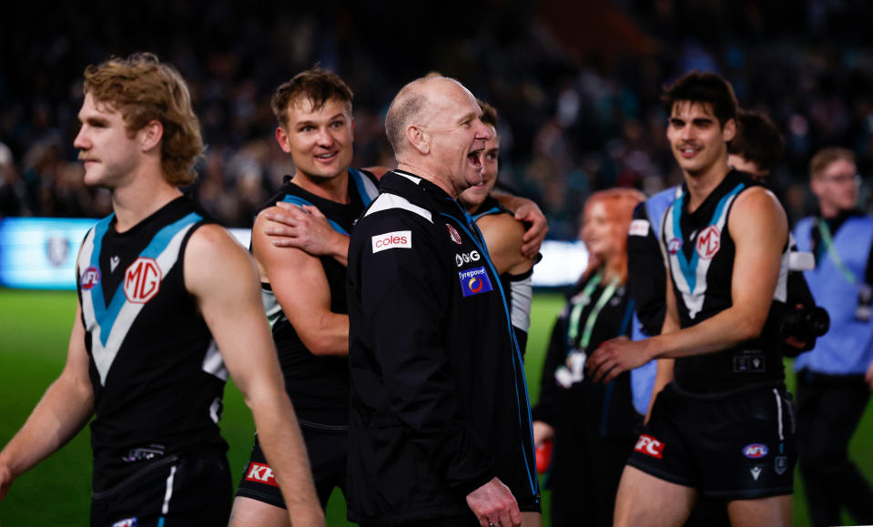 ADELAIDE, AUSTRALIA - SEPTEMBER 13: Ken Hinkley, Senior Coach of the Power exchanges words with Hawthorn players after the 2024 AFL Second Semi Final match between the Port Adelaide Power and the Hawthorn Hawks at Adelaide Oval on September 13, 2024 in Adelaide, Australia. (Photo by Michael Willson/AFL Photos via Getty Images)