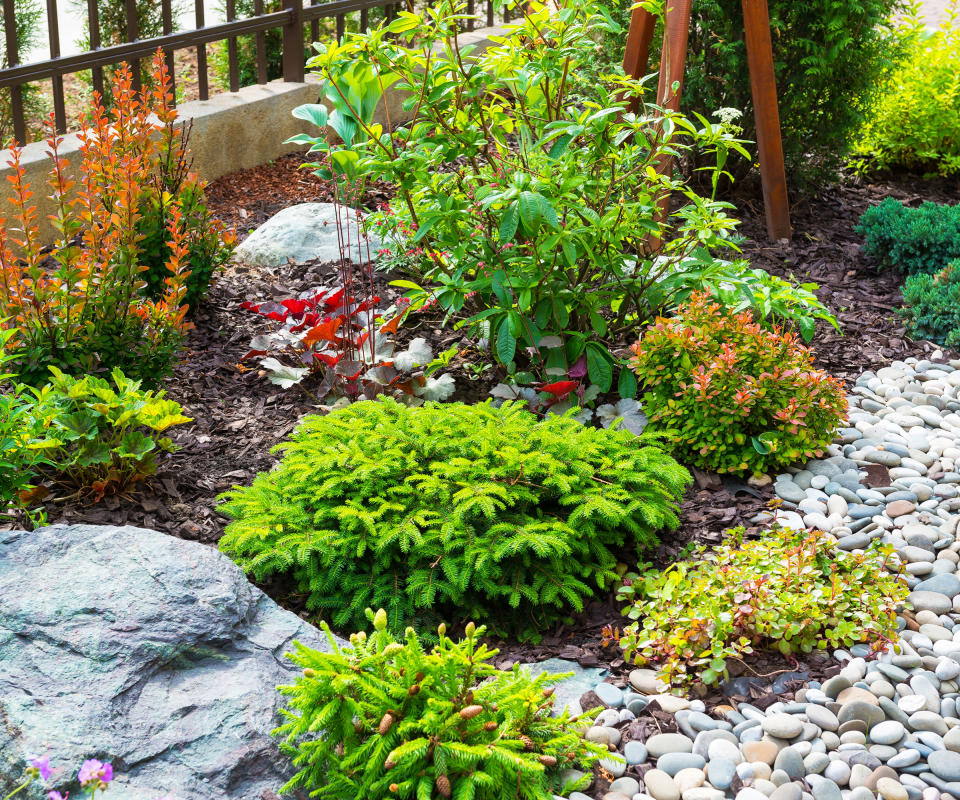 garden border with landscaping rocks and pebbles