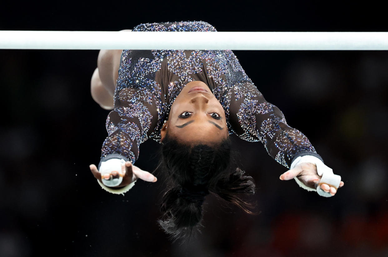 PARIS, FRANCE July 28, 2024-USA's Simone Biles competes on the uneven bars during qualifying for women's team gymnastics at the 2024 Olympics in Paris, France Sunday(Wally Skalij/Los Angeles Times via Getty Images)