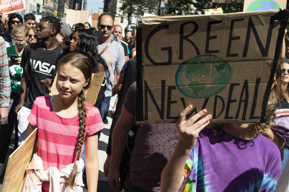 Swedish environmental activist Greta Thunberg, left, takes part during the Climate Strike, Friday, Sept. 20, 2019 in New York. | Eduardo Munoz Alvarez—AP