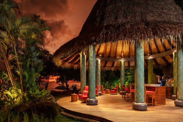 <p>Gerry O'Leary/Courtesy of Anantara Maia Seychelles Villas</p> Evening at the Sunset Pool Bar at Anantara Maia Seychelles Villas.
