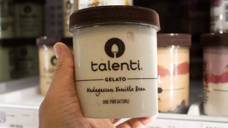 Hand holding Talenti gelato jar