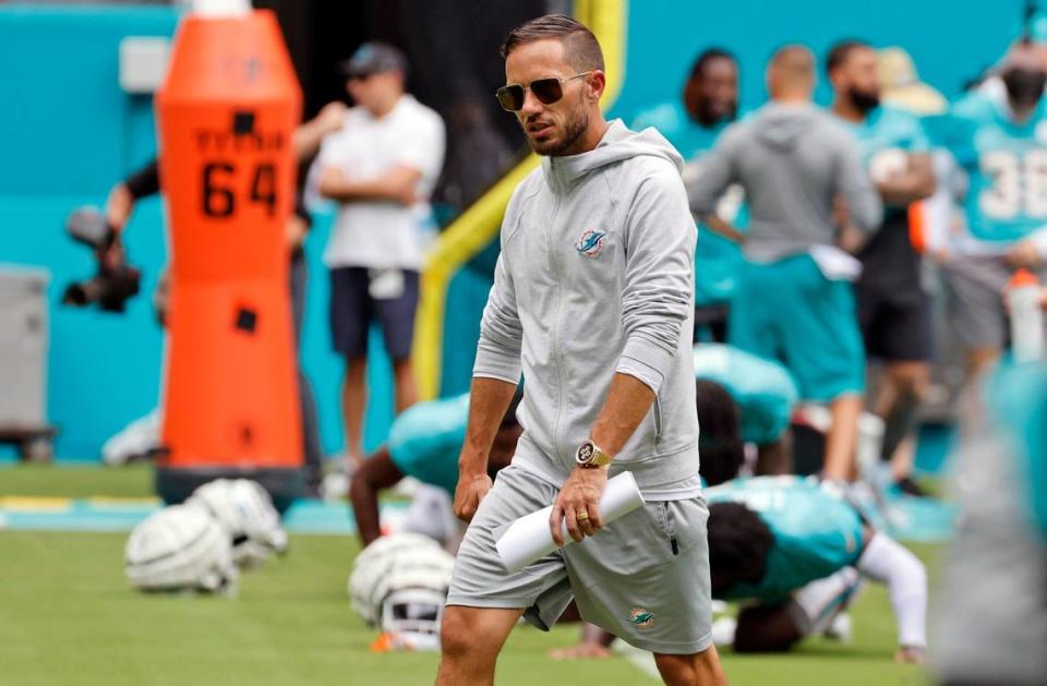 Miami Dolphins coach Mike McDaniel keeps an eye on players during warmups before a team scrimmage at Hard Rock Stadium in Miami Gardens on Saturday, August 5, 2023.