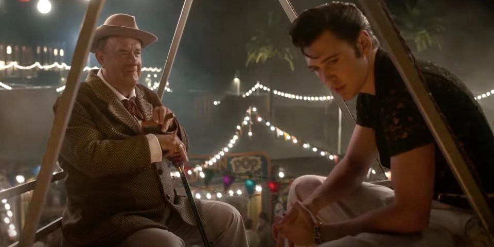 Tom Hanks as Colonel Tom Parker sitting next to Austin Butler as Elvis