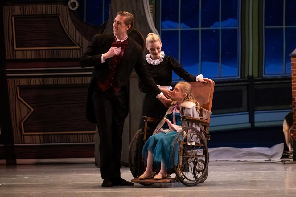 Olivia McGivney-Francis, right, plays the newly added character of Marie Stahlbaum in Oklahoma City Ballet's 2022 production of "The Nutcracker." From left are Jameson Keating as Herr Stahlbaum and Amelia Aroneo as the maid.