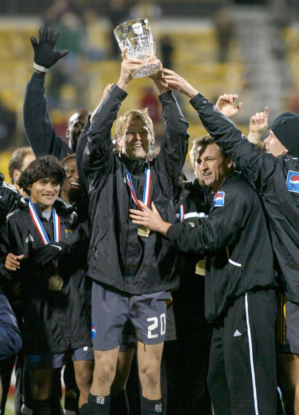 (USCUP MERZ LAURON 24OCT02) Columbus Crew Brian McBride (cq) 20, holds up the trophy he and his team received for winning the Lamar Hunt U.S. Open Cup Finals at the Columbus Crew Stadium, October 24, 2002. (Dispatch photo by Neal C. Lauron)