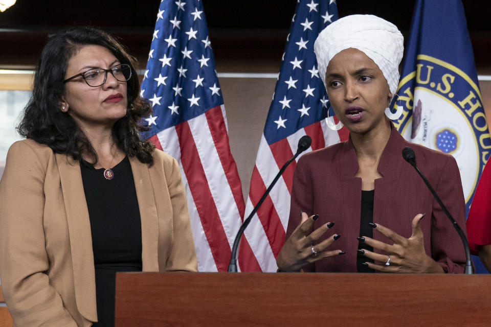 FILE - In this July 15, 2019, file photo, U.S. Rep. Ilhan Omar, D-Minn, right, speaks, as U.S. Rep. Rashida Tlaib, D-Mich. listens, during a news conference at the Capitol in Washington. Reps. Omar and Tlaib plan to host a news conference Monday, Aug. 19, 2019 on travel restrictions to Israel and Palestine, after they were denied entry into Israel last week. (AP Photo/J. Scott Applewhite, File)