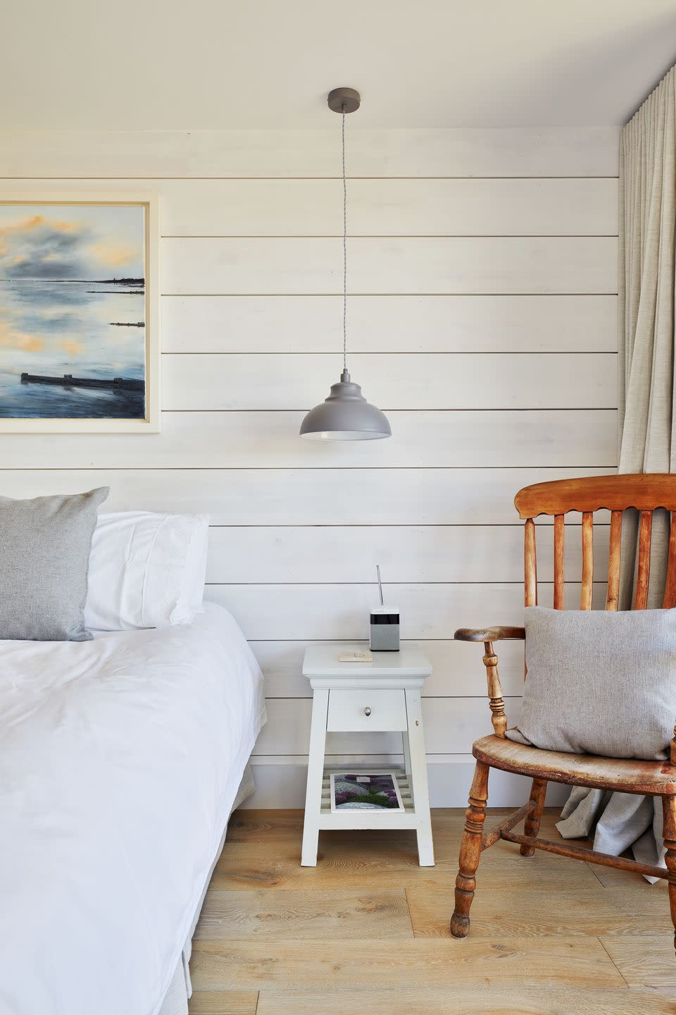 pale white bedroom in a 1970s coastal home