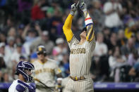 San Diego Padres' Juan Soto gestures as he crosses home plate after hitting a solo home run off Colorado Rockies relief pitcher Carlos Estevez in the eighth inning of a baseball game Friday, Sept. 23, 2022, in Denver. (AP Photo/David Zalubowski)