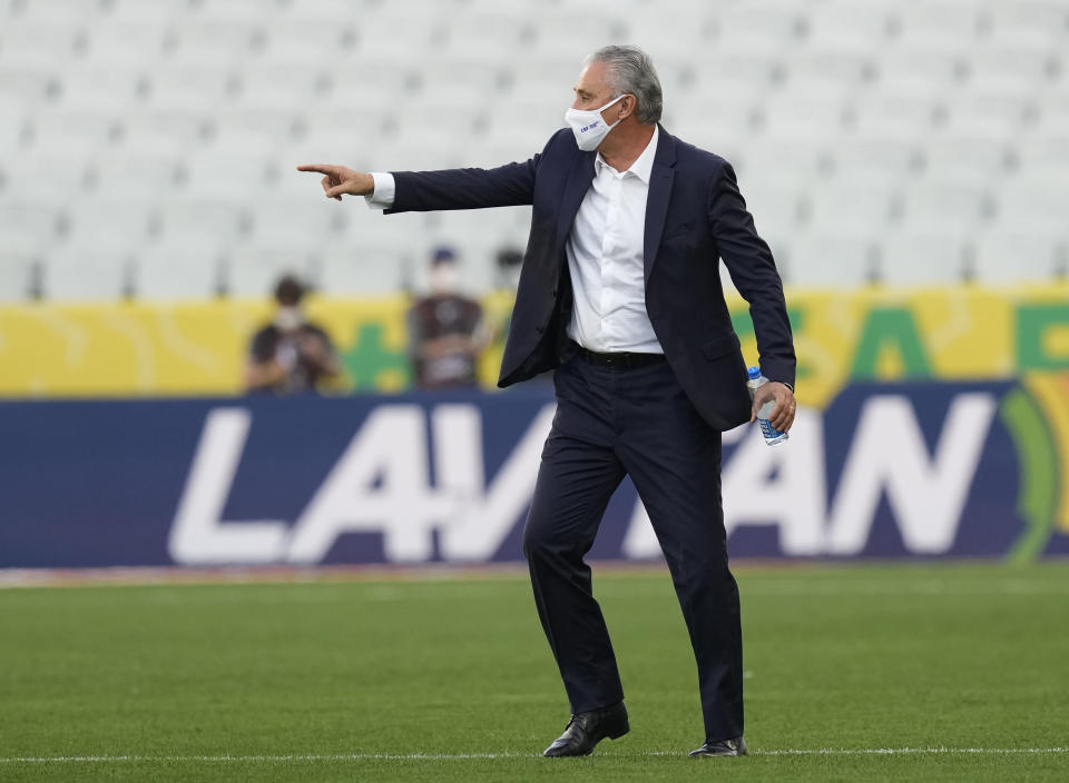 Brazil's coach Tite gestures as the qualifying soccer match for the FIFA World Cup Qatar 2022 game against Argentina is interrupted by health authorities at Neo Quimica Arena stadium in Sao Paulo, Brazil, Sunday, Sept.5, 2021. (AP Photo/Andre Penner)