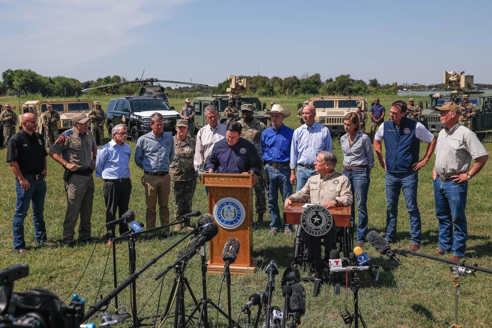 Texas Governor Greg Abbott, right, and Arizona Governor Doug Ducey, left, backed by other Republican Governors, military leaders, and law enforcement officers, speaks at a press conference on the United States' southern border in Mission, Texas on Oct. 6, 2021 to speak on the Biden Administration's lack of action on what they described as the continuing crisis at the border.