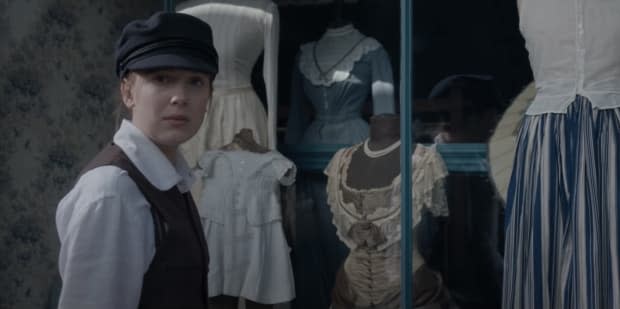 Enola in disguise in young Sherlock's clothes.