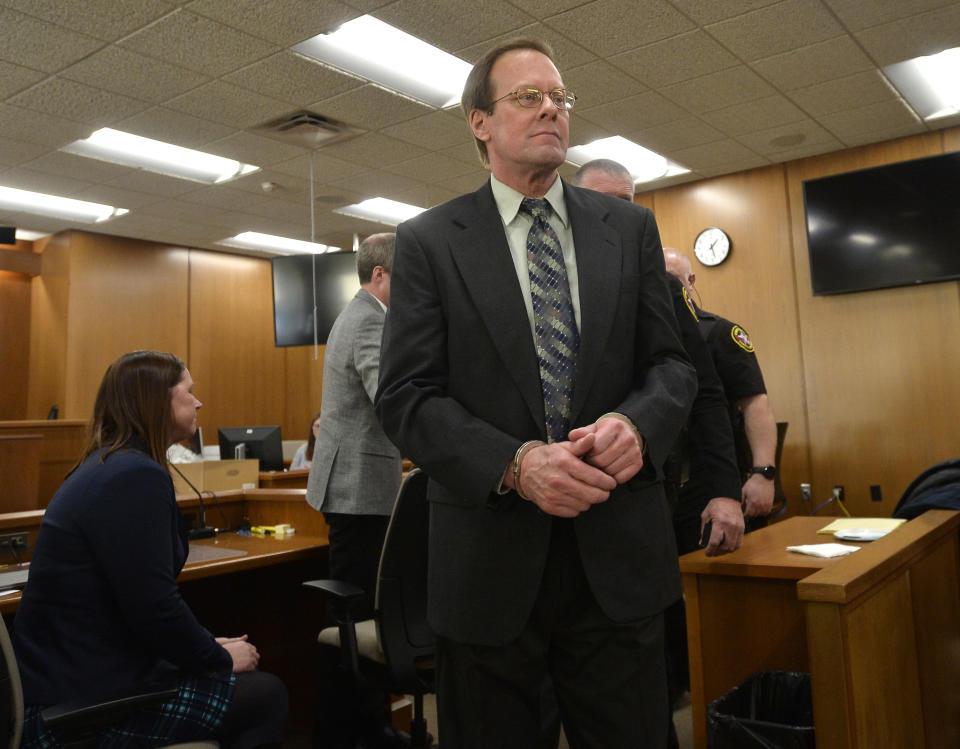 Mark Jensen is led out of the courtroom in handcuffs after a guilty verdict in his trial at the Kenosha County Courthouse on Wednesday, Feb. 1, 2023, in Kenosha, Wis. The Wisconsin Supreme Court ruled in 2021 that Jensen deserved a new trial in the 1998 death of his wife Julie Jensen, who was poisoned with antifreeze. (Sean Krajacic/The Kenosha News via AP, Pool)